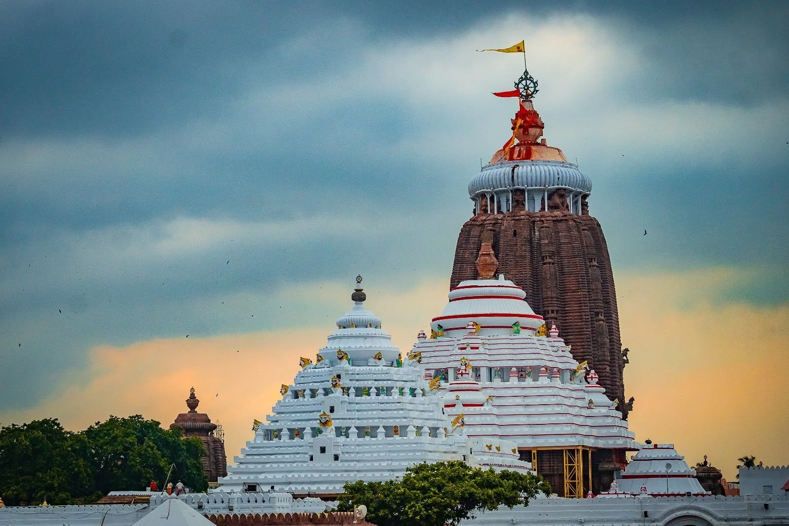 Aerial view of Jagannath Temple in Puri, Odisha, showcasing the grand spire and temple complex under a clear blue sky.