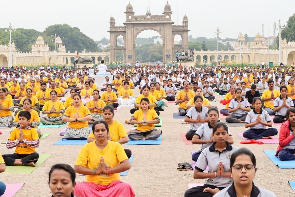 Yoga enthusiasts perform asanas at Kartavya Path during International Yoga Day 2025